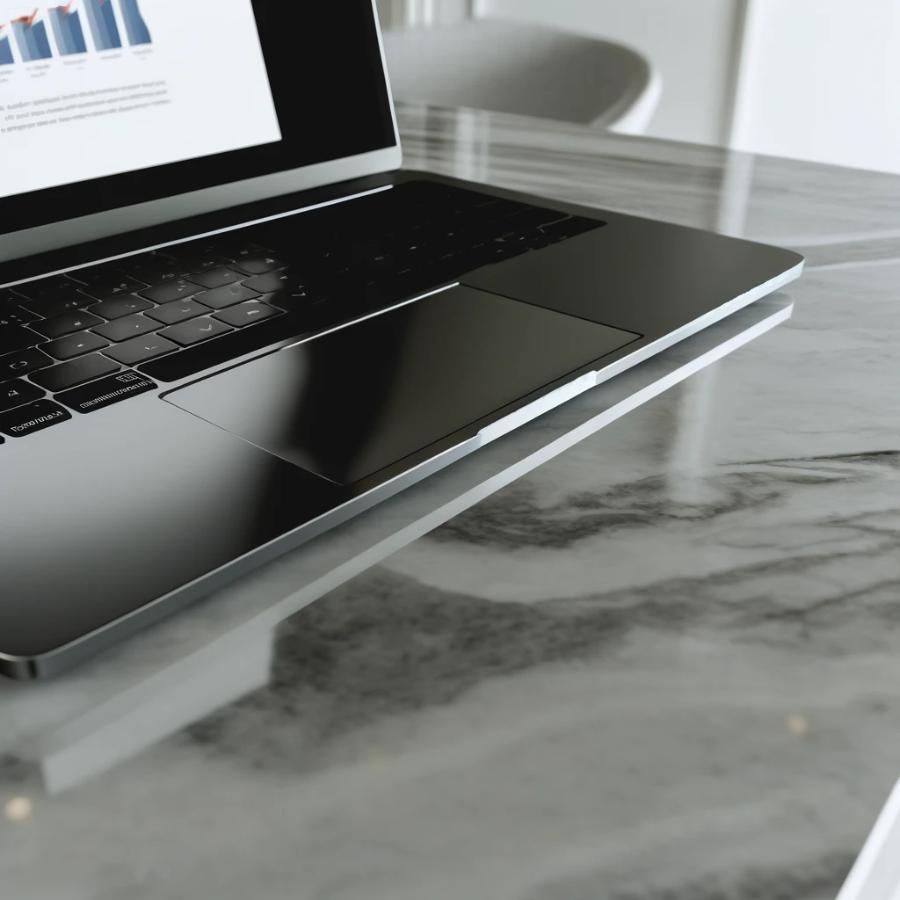 DALL·E 2024-04-22 15.47.01 – A modern laptop open on a polished marble countertop. The screen displays a detailed report with charts and text, emphasizing a business or academic s