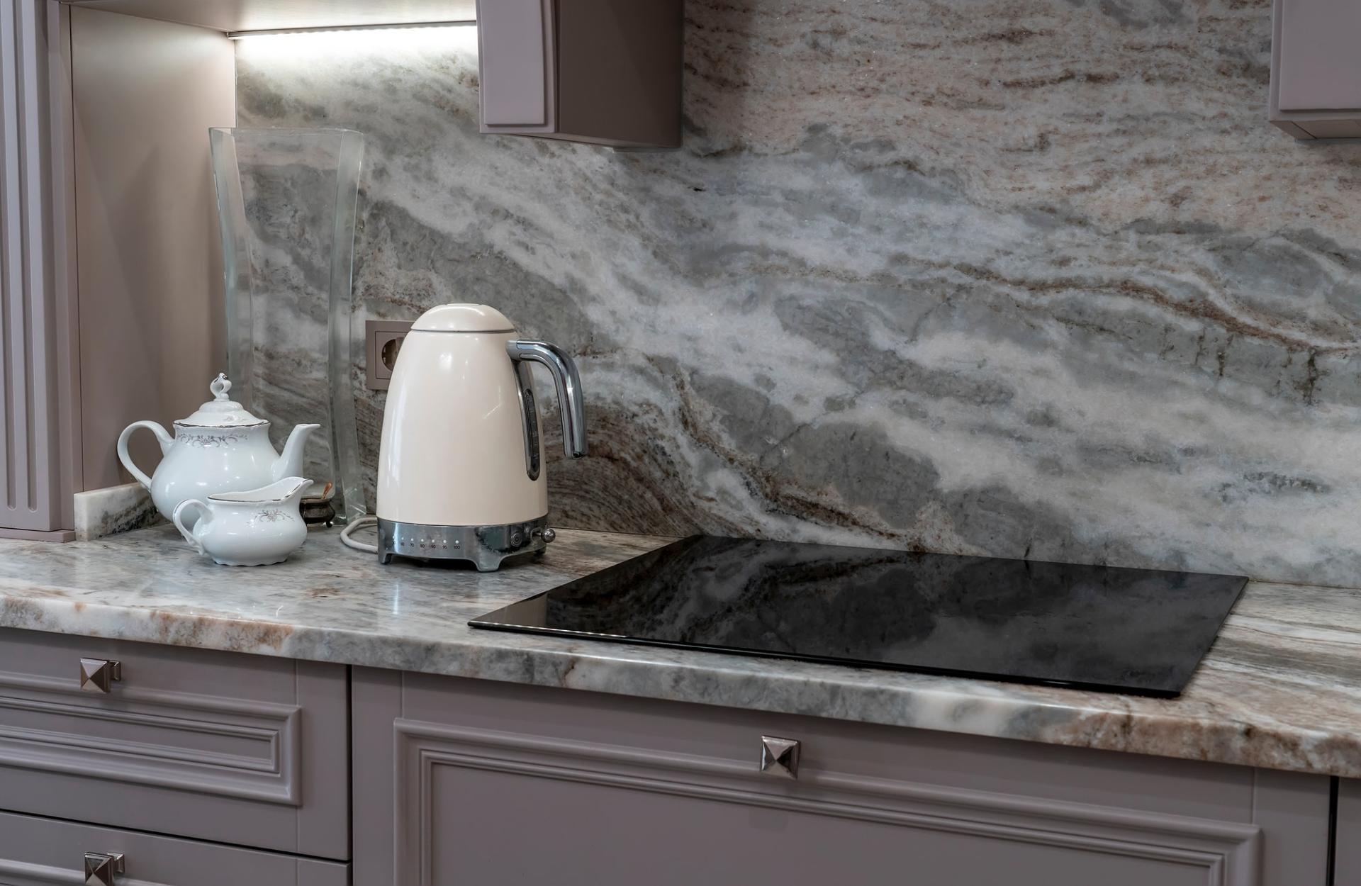 beautiful-closeup-of-custom-designed-kitchen-with-marble-looking-quartz-countertop-and-backsplash-.jpg
