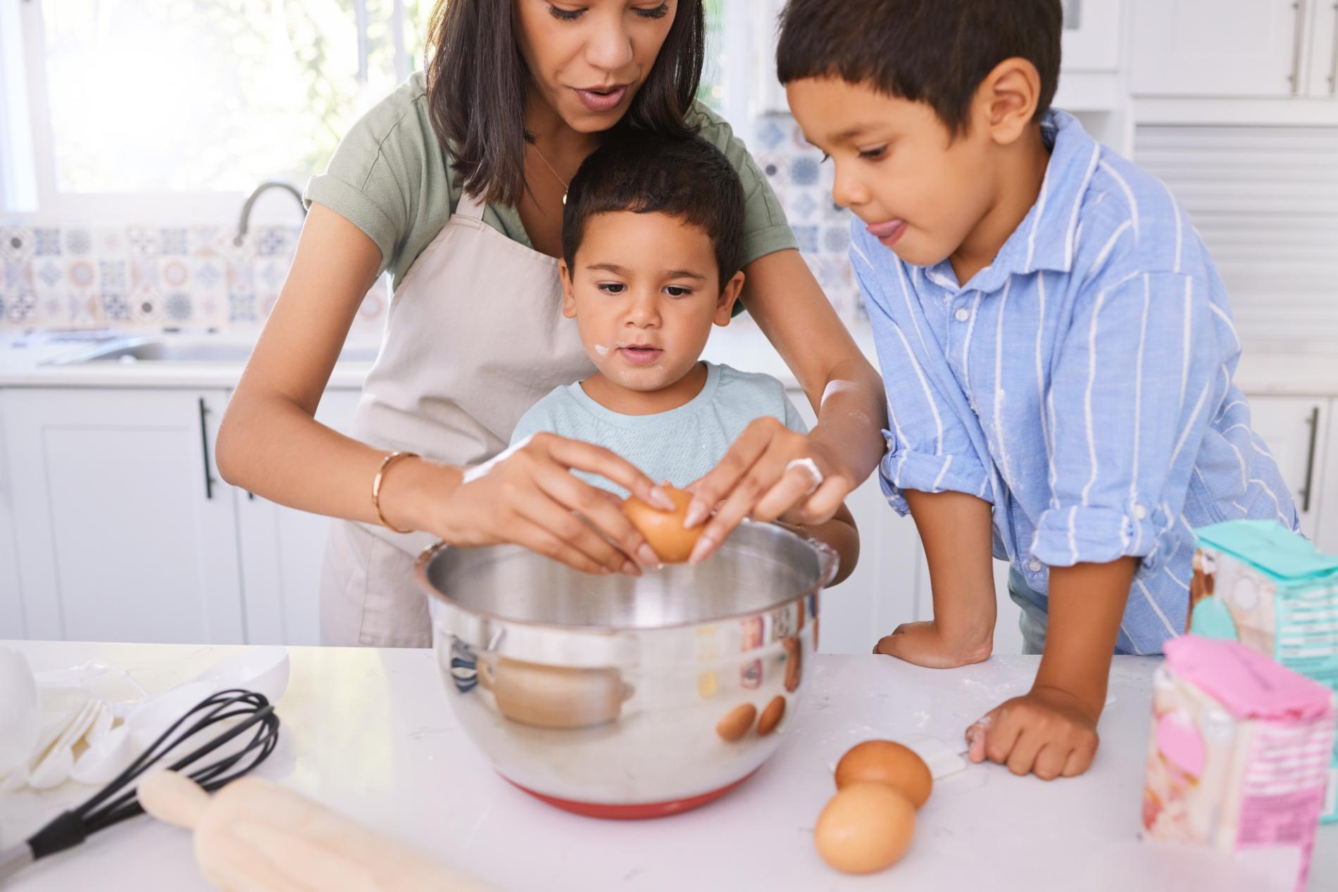 cooking-learning-and-mother-with-children-in-kitc-2023-11-27-05-03-12-utc.jpg