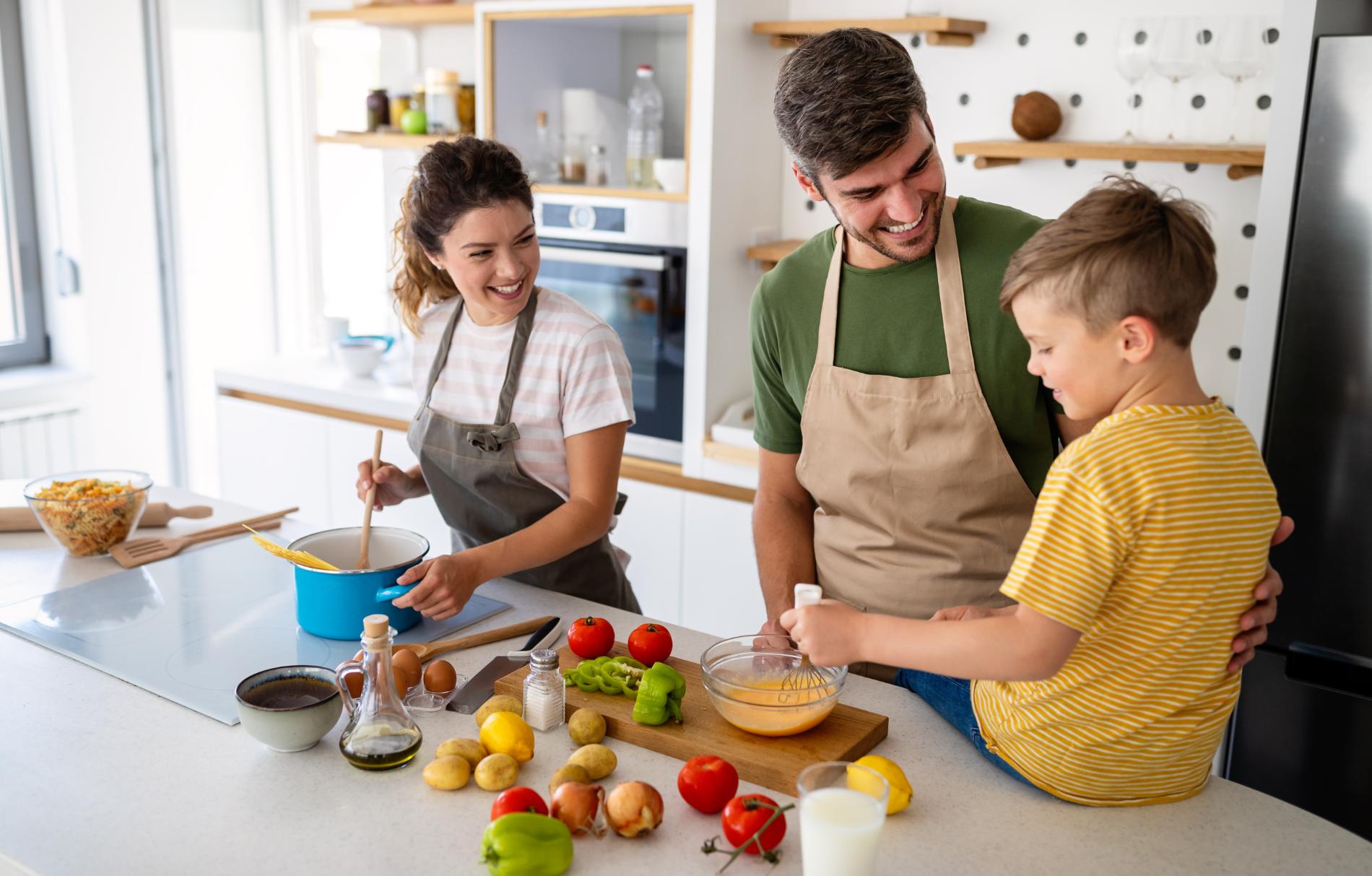 happy-family-in-the-kitchen-having-fun-and-cooking-2023-11-27-05-25-18-utc.jpg