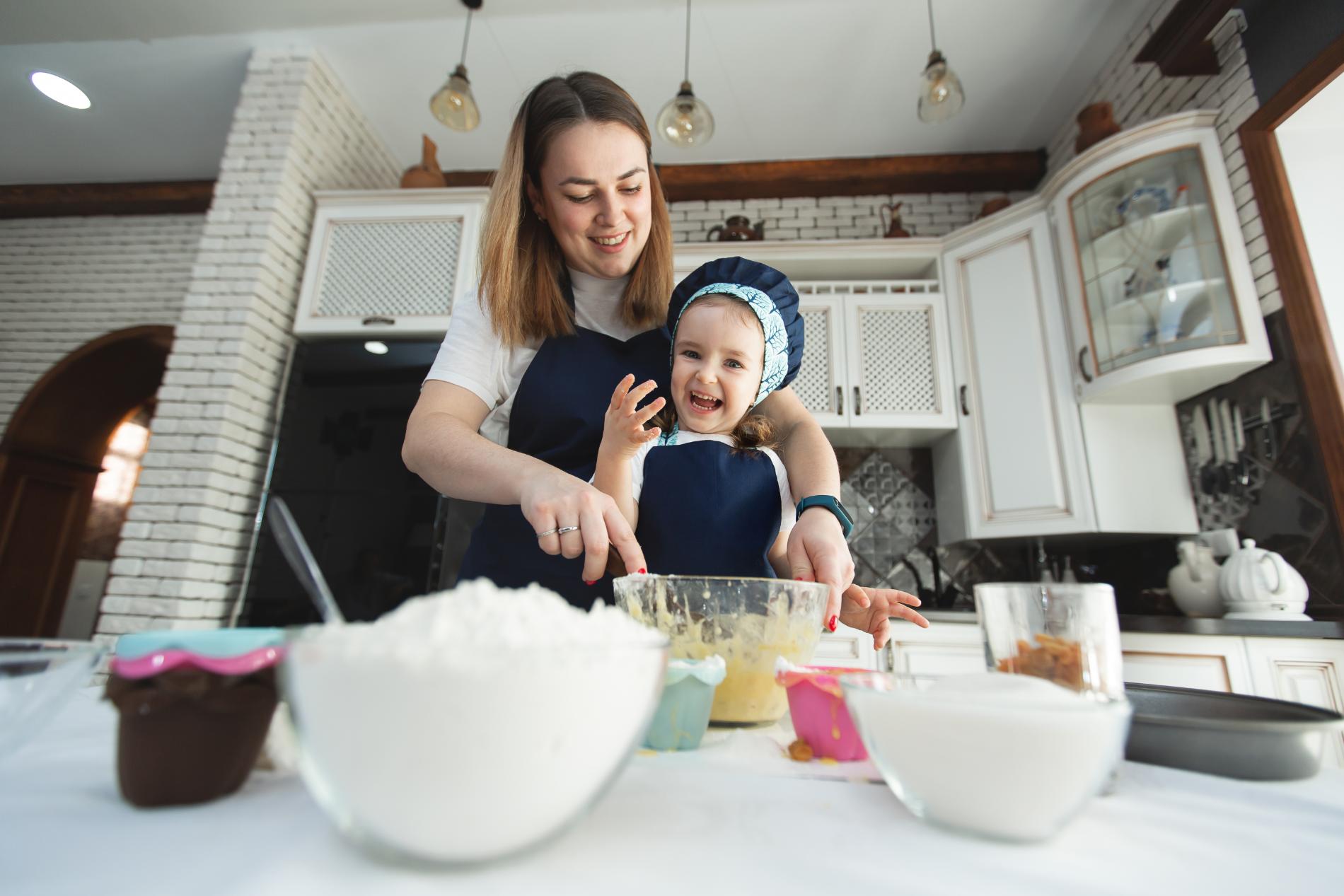 mother-and-daughter-in-identical-aprons-and-chef-2024-08-08-06-27-41-utc.jpg