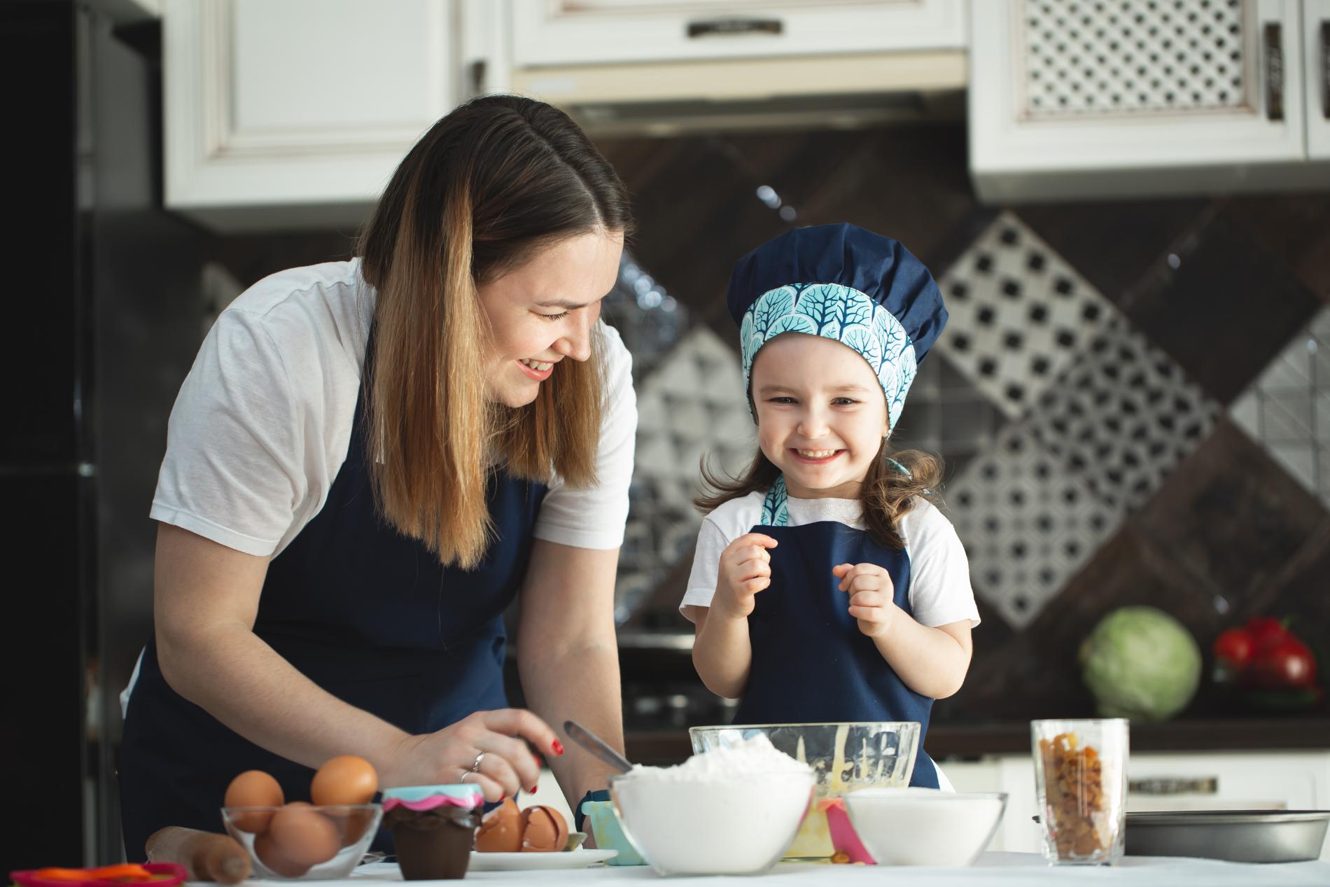 young-mother-and-daughter-in-the-kitchen-preparing-2024-08-08-08-12-04-utc.jpg